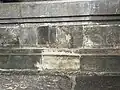 Bas-relief of Dharmacakra and Crouching Deers beneath the plinth inside the temple