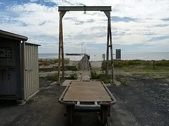 The Cape Jaffa jetty and a trolley that runs on the railway line, used for moving seafood from the boats to the coldstores behind the jetty