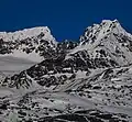 Mount Carmack on the right, as identified by the USGS. The true summit of the massif is on the left.