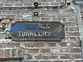 Plaque at number 19 of Digue Square. Tonneliers Street ran alongside the "Sâle Dèbout". The plaque is opposite Digue Street, at the former corner of the "Sâle Dèbout".