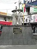 Statue dedicated to charros in the plaza in front of the municipal palace. Part of the inscription reads "For more than a century, our men and women have celebrated the "Carnaval de Charros" with their characteristic masks and outfit year after year and it is our pride to continue preserving this noble tradition"