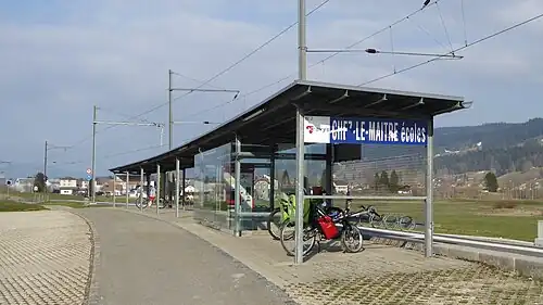 Station shelter next to railway track