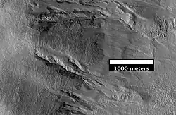 Close-up of Chincoteague crater, as seen by HiRISE. Image close-up view of previous image. Note the gullies and associated landforms.