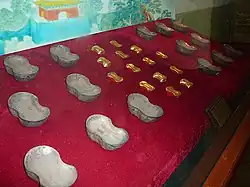 Molds for Chinese sycee, a form of silver or gold ingot used as currency under the empire.