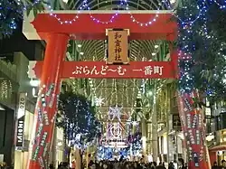 A temporary Torii for new year celebration in a shopping street decorated with Christmas lights