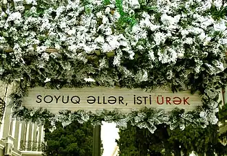 A stand with the name of the market on it