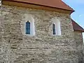 Windows on S of nave showing alterations and evidence for an earlier window.