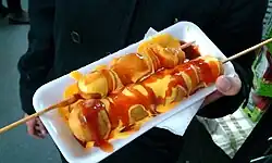Corn dogs from a Christmas tianguis in the streets of Colonia Industrial, Mexico City