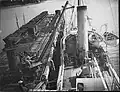 Refuelling the NZGSS Hinemoa with coal at Opua in 1902