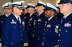 Members of the United States Coast Guard in Full Dress Blue during a change of command ceremony at Coast Guard Base Kodiak.
