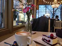 Image 11A cup of coffee with cheesecake at a cafe in Helsinki, Finland (from Coffee culture)