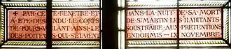 Detail of the stained glass window with the removal of the body.