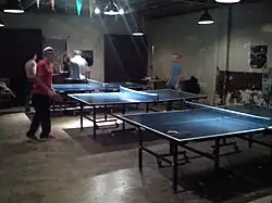 A ping pong table inside of the restaurant