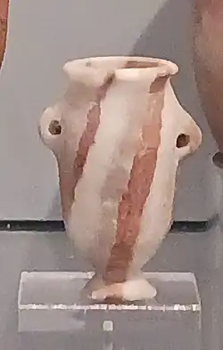 A multicolor stone vessel: red and white limestone jar. Naqada Tomb T4. Naqada IIB.[65]