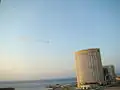 A plane flying over Tripoli's Corinthia Hotel during an air show rehearsal on 30 August.