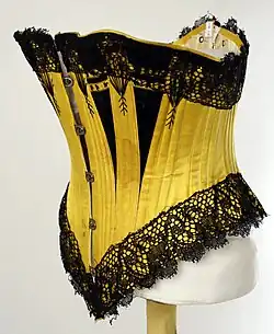 English underbust corset in contrasting black and yellow, 1880
