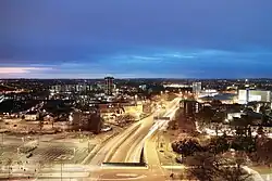 Night view of the road and slip roads with car headlights forming a continuous strip along the anticlockwise carriageway