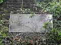 Plaque on retaining wall commemorating the Station's history