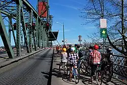 Cyclists waiting during a bridge lift