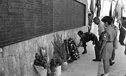 The then Israeli Minister of Defense Moshe Dayan has a wreath laid at the Paratroopers Memorial in Sept. 1969