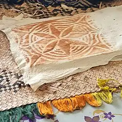 Powdered clay dabbed over the design darkens the pattern.