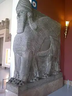Ancient Assyrian lamassu sculpture with five legs and lion's feet