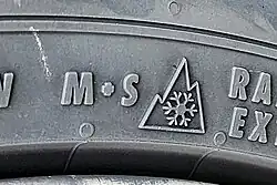Snow tire sidewall with M+S and 3PMSF markings.
