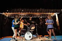 Drummer Harry Miree visits Lutz K-8 School in Tampa, FL. Miree and basketball star Charles Barkley combined efforts to donate more than 100 drum sets to United States schools along Miree's tour route with HARDY from 2021 through 2025.