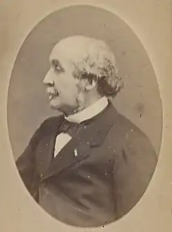 Sepia-toned black and white photograph of Albert de Broglie faced left