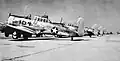 North American AT-6C Texan trainers on flight line.