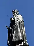 Statue of King Edward VII aligned with the daytime moon, zoomed in.