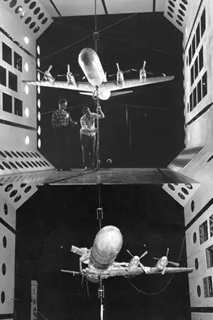 A model of an aircraft in a wind tunnel
