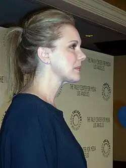 A smiling Elizabeth Perkins