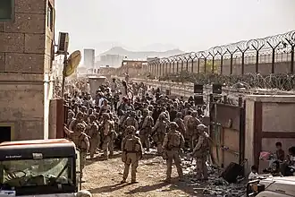 US Marines with SP-MAGTF-CR-CC at an evacuation checkpoint at Kabul Airport on 21 August during the 2021 Fall of Kabul, at the end of the War in Afghanistan.