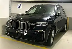 Car with a Corps Consulaire sticker.