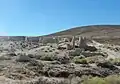 Fairmont Mill ruins on the east side of Fairmont Butte. This mill was one of three that the city ran to produce cement for the Los Angeles Aqueduct.