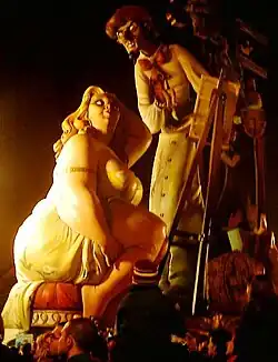 Falla with painter and fat woman. This was as high as a building.