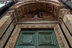Tympanum above main door.