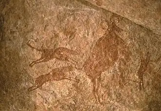 Image 7Petroglyph depicting two dogs hunting – Tassili n'Ajjer, Algeria (from Domestication of the dog)