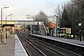 The station footbridge, with new catenary masts visible beyond.