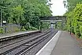 Two footbridges beyond the northern end of the station.