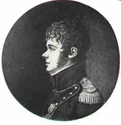 Side on profile, his hair is thicker and he sports mutton-chops. In comparison to the above image his unform is less regal and he wears less medals and decorations.