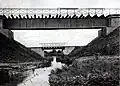 A black-and-white photograph of bridges over the Niemica River.