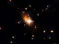 Arc-shaped tidal tails in galaxy 3C186.[24]