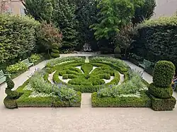 Geometric parterre with clipped boxwood topiary at Hôtel de Caumont in Aix-en-Provence.