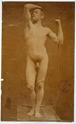 Black and white photograph of Auguste Neyt, nude male model posing for Rodin's sculpture L'Âge d'airain