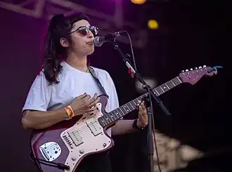 Georgia Maq performing with Camp Cope at Laneway Festival in 2019