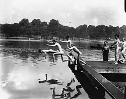 A group of naked boys jumping into a lake in Hyde Park during a heat wave in 1920