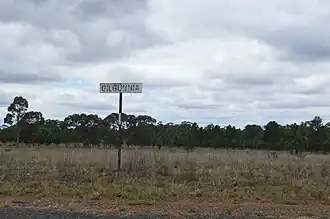 Road sign at the entry to the site of the former village at Gilgunnia (2017).