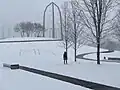 Park during a winter snowstorm.